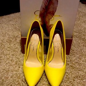 Women yellow high heel shoe in a size 8.5. They have been worn.